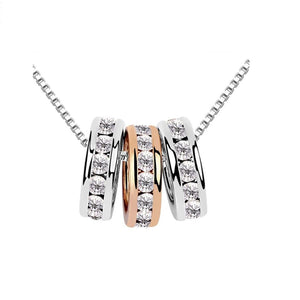 Rose Gold And Silver Rings on Necklace